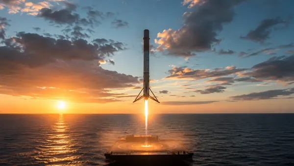 Reusable rocket booster landing on a droneship at sea, illustrating why reusable rockets are important to space travel